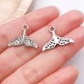 Diamond-studded silver whale tail charm with white rhinestones on fingertips - White K Rhinestone Fish Tail / 19x15mm