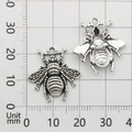 Macro detail of bee charms with 18x20mm measurement on a grid scale for DIY projects - Bee Style (9187)