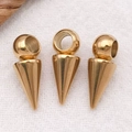 Detailed macro shot of three gold punk cone pendants for DIY necklaces and earrings - Vacuum Plated Gold Large Hole Cone Pendant (T2968) / 6x10x6mm Hole 3.5mm