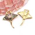 Macro detail of manta ray charms with iridescent abalone shell inlay and gold metal finish - AB Color Colorful Shell Manta Ray Style (T2492)