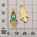 DIY rocket charm for bracelets in red and green enamel finish, size 28mm x 12mm - Enamel Rocket Style (11061)