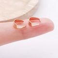 U-shaped gold jewelry connectors for DIY jewelry making shown on a fingertip - Connecting Buckle (8634) / 2000 Pieces/Pack (6x9mm) / KC Gold
