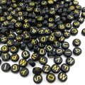 Close-up of black and gold acrylic letter beads for DIY jewelry and crafts making - Round Letter Beads / 100 Pieces/Pack (4x7mm) / Black with Gold
