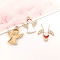 Drie vergulde engelhangers met wit en rood emaille en schitterende strass-steentjes - Witte Emaille Kerst Engel (12519)