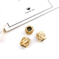 Three gold woven star crown charms for DIY bracelets with detailed hollow textures - Woven Cylinder (14679) / Gold