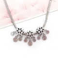 Silver snake chain necklace with multiple winter snowflake pendants and layered charms - Snowflake Hole Pendant (15210)