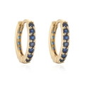 Macro view of gold hoop earrings with vertical row of deep blue round zircons - Gold Blue Rhinestone