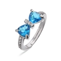 Detailed macro view of an adjustable bow ring with blue gems and white zircon inlay - Platinum Sea Blue Zirconia