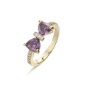Close-up of golden bow-shaped ring with purple crystals and fine diamond inlay - Gold Purple Zirconia