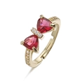 Macro detail of adjustable gold bow ring featuring red triangle zircons and clear crystals - Gold Red Zirconia