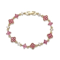 Detailed close-up of a gold-plated flower bracelet with red and white zircon inlays - Gold Plated Rose Red Zirconia