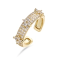 Macro shot of three-row pave white zircons on a gold-plated adjustable clover ring - Gold White Zirconia Clover Ring