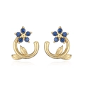 Detailed close-up of golden flower stud earrings featuring elegant deep blue petal crystals - Gold Blue Zirconia Flower Stud Earrings
