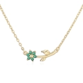 Detailed macro view of golden flower necklace pendant with emerald green gemstones - Gold Green Zirconia Flower Necklace
