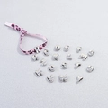 Macro view of silver metallic alphabet charms with pink leopard print ribbon detail - Letter A / Pink Leopard Cord + Platinum Letter