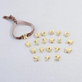 Close-up of golden alphabet beads and leopard print rope showing detailed metallic texture - Brown Leopard Rope + Gold Letter