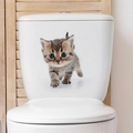 Close-up of a cute kitten wall sticker on a white ceramic toilet tank in a bathroom - Big Eyed Tabby Cat Walking (FX04)