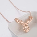 Minimalist rose gold origami reindeer necklace with a geometric hollow deer head pendant - Rose Gold