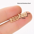 Macro detail of gothic style year 1980 gold stud earring in polished stainless steel - 1980 Gold