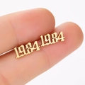 Detailed view of gold 1984 number earrings in gothic font style for women - 1984 Gold