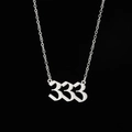 Macro detail of gothic style silver 333 angel number pendant on a fine link chain - 333 Steel