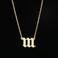 Macro detail of gothic letter m pendant in gold finish on a fine stainless steel chain - 111 Gold