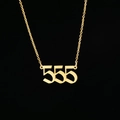 Macro shot of gold stainless steel gothic 555 angel number pendant on a link chain - 555 Gold