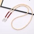 Detailed shot of faux stone bead crossbody chain with silver lobster clasps for bags - Red Agate Natural Stone