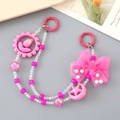 Pink beaded chain with chiffon bow and tulip pendant close-up for bags or phones - Hand Chain / Rose Red