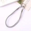Close-up of grey braided leather keychain lanyard with polished silver metal ring - Silver