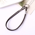 Close-up of dark brown braided leather keychain with silver metal spring buckle - Dark Brown