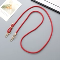Detail of red braided leather strap with gold lobster clasp and adjustable ring - Red