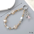 Detail of 15cm beaded rose keychain with amber crystals and silver bow on grey background - Champagne Rose (K4730)