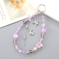 Detail of purple crystal beaded phone strap with silver moon and star charms - Purple