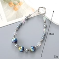 Dettaglio del portachiavi di 15 cm con perle a stella e grigie con chiusura a molla d'argento - Ciondolo 3 Perline Stellari Colorate Grigio (K4743)