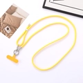 Close-up of vibrant yellow braided phone lanyard with metallic clips and clear gasket - Yellow