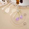 Detail of pearl phone strap with tulip charms and white woven pearl bow accessories - Purple Tulip / Purple Bow (K4971)