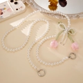 Detail of pearl phone strap with green silk bow and fabric tulip charms - Light Pink Tulip / Pink Bow (K4970)
