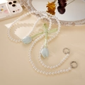 Detail of pearl phone strap with green satin bow and light blue tulip pendants - Light Blue Tulip / Green Bow (K4969)