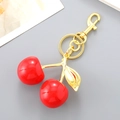 Creative resin cherry keychain in bright red with gold leaf and lobster clasp - Red