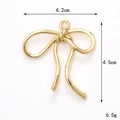 Detailed view of golden alloy bow pendant showing dimensions 4.2cm width and 4.5cm height - Gold (D3116)