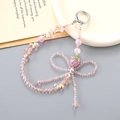 Pink crystal strawberry bow phone strap with beads and shimmering sequins hanging accessory - Pink