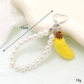 Handmade crochet banana charm phone strap with white pearls and heart spring clasp - Banana (K5122)
