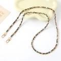 Detail of colorful woven fabric and gold chain strap with lobster clasps on tray - Crossbody Chain (K5027)