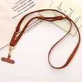 Detail of adjustable brown leather phone lanyard with gold metal lobster clasp and T-patch - Brown (K5160)