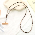 Detailed view of leopard print phone strap with silver ring clasp on soft fabric background - Crossbody Chain (K5101)