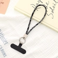 Detail of leopard print phone lanyard with silver metal clasp on artistic fabric background - Wrist Charm (K5092) / Gray