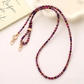 Detail of colorful woven strap with golden metal lobster clasps and ethnic stripe pattern - Rose Red