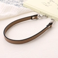 Detail of a brown PU leather wrist strap with high-quality silver lobster clasp for handbags - Cross Pattern Leather Hand Chain / Khaki