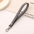 Close-up of grey leather wrist strap with silver rivet and polished lobster clasp - Cross Pattern Leather Hanger / Gray
